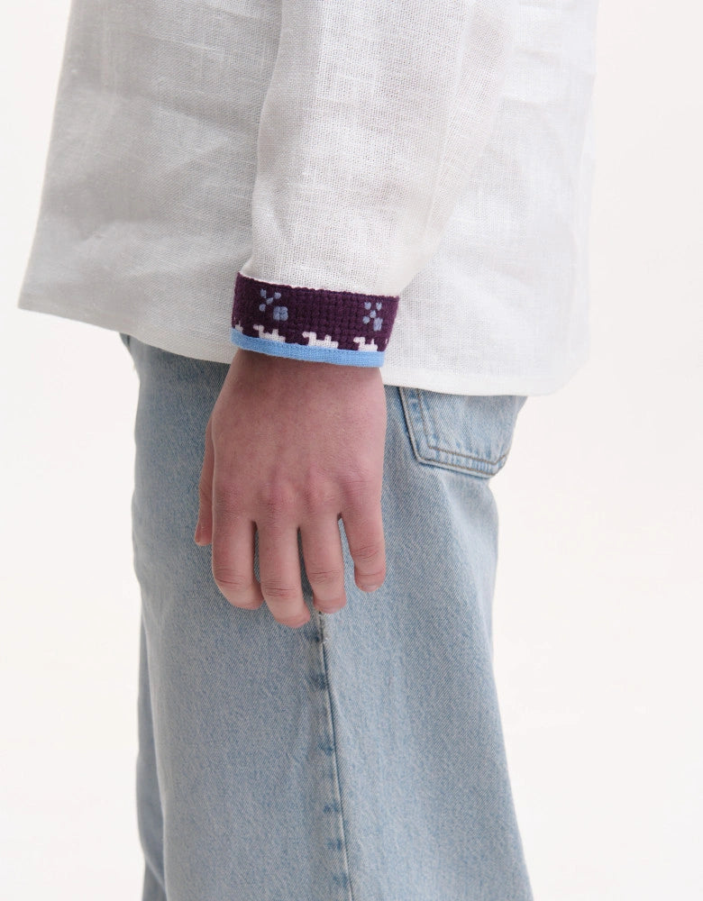 Model wearing Koza Dereza men's linen vyshyvanka, Free Steppes motif