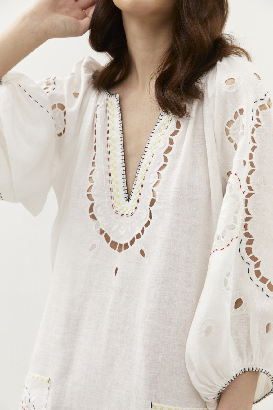 Model wearing the Merezhivo white linen maxi dress