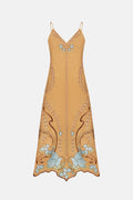 Mustard yellow slip dress with floral embroidery on a white background
