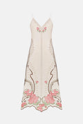 Elegant dress with floral embroidery on a white background