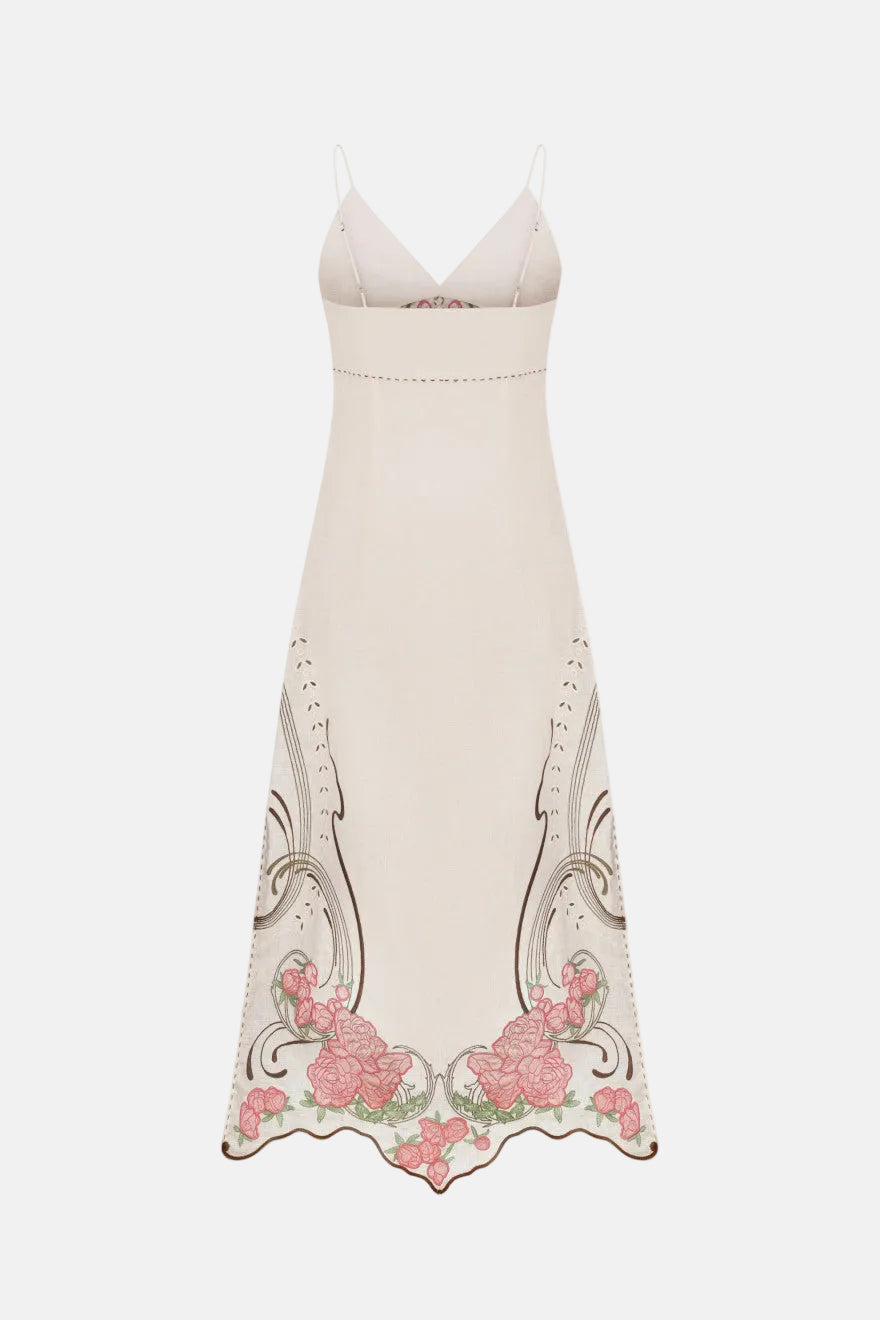 White dress with floral embroidery on a white background