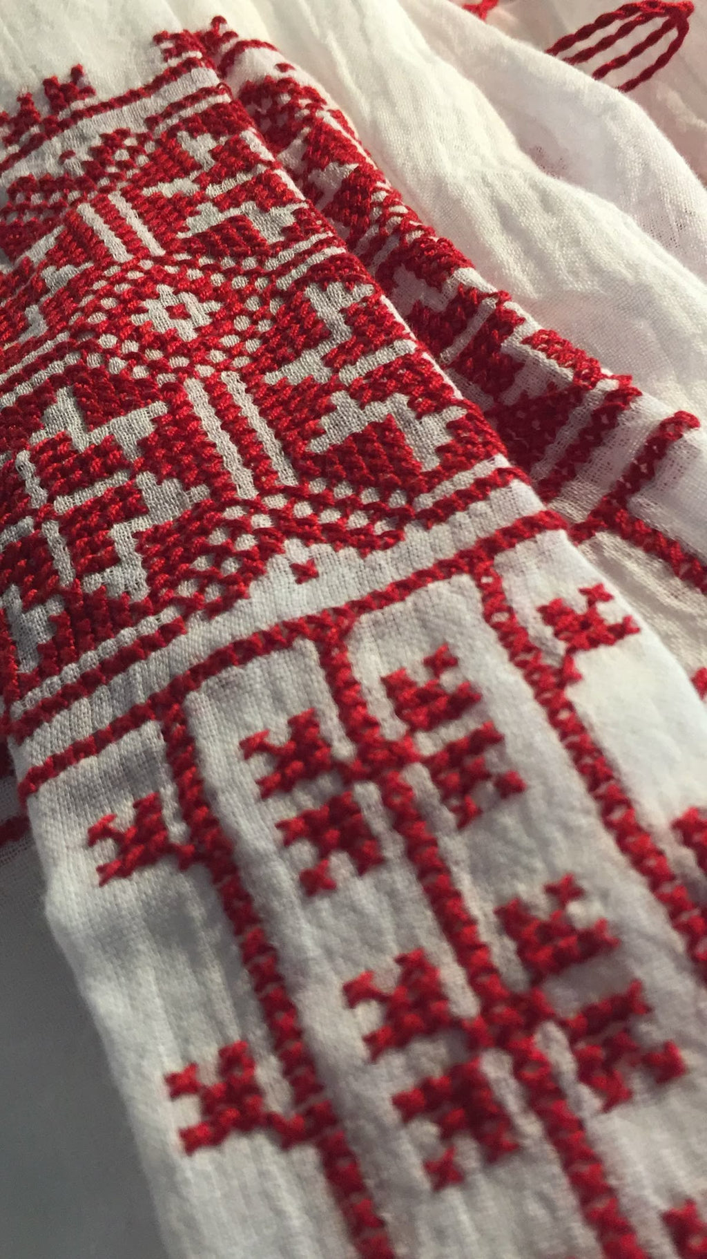 Close-up of a textile with red and white geometric pattern