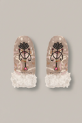Pair of mittens with decorative design and lace cuffs on a white background