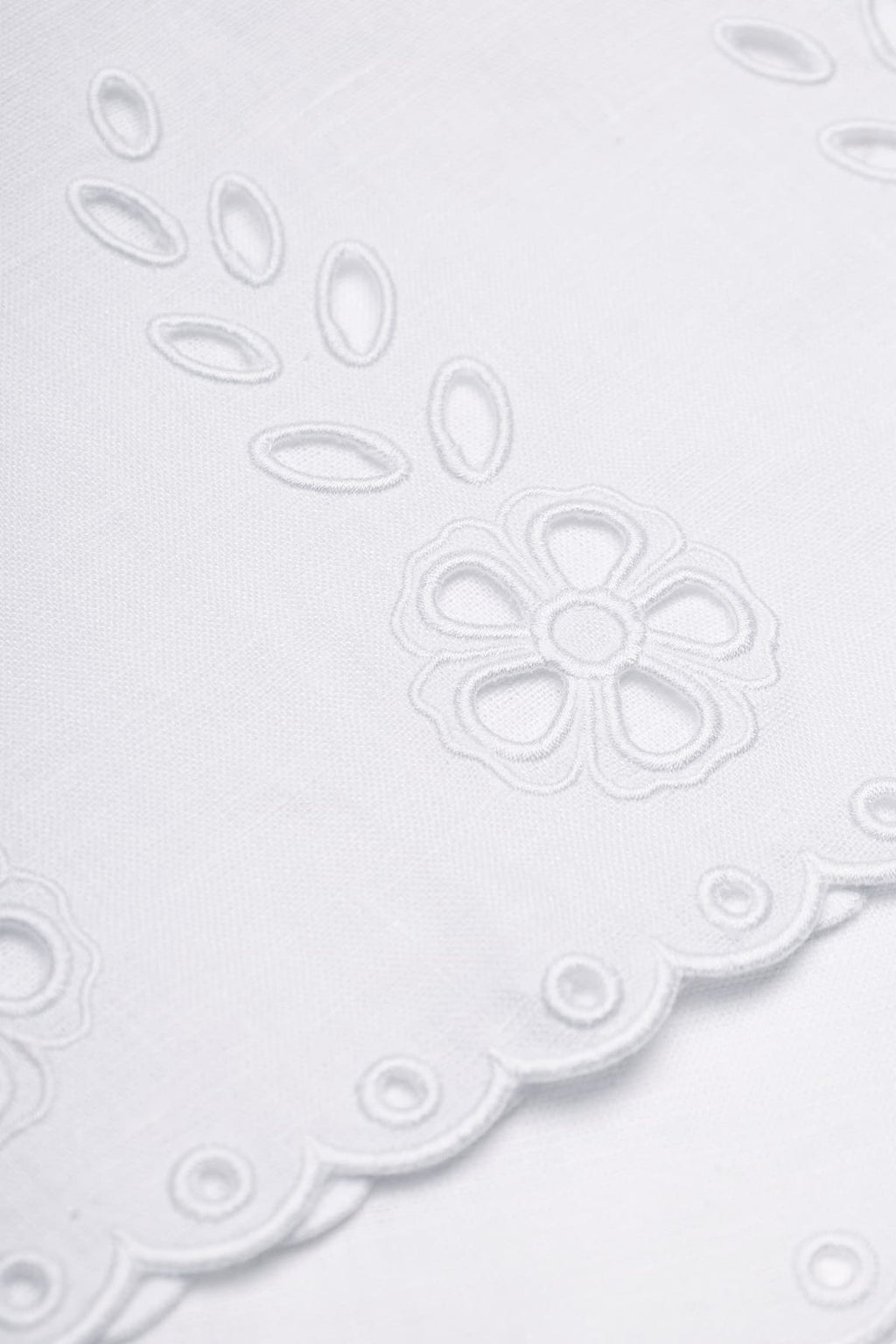 White linen cropped tank top with vytynanka cutout embroidery - fabric detail