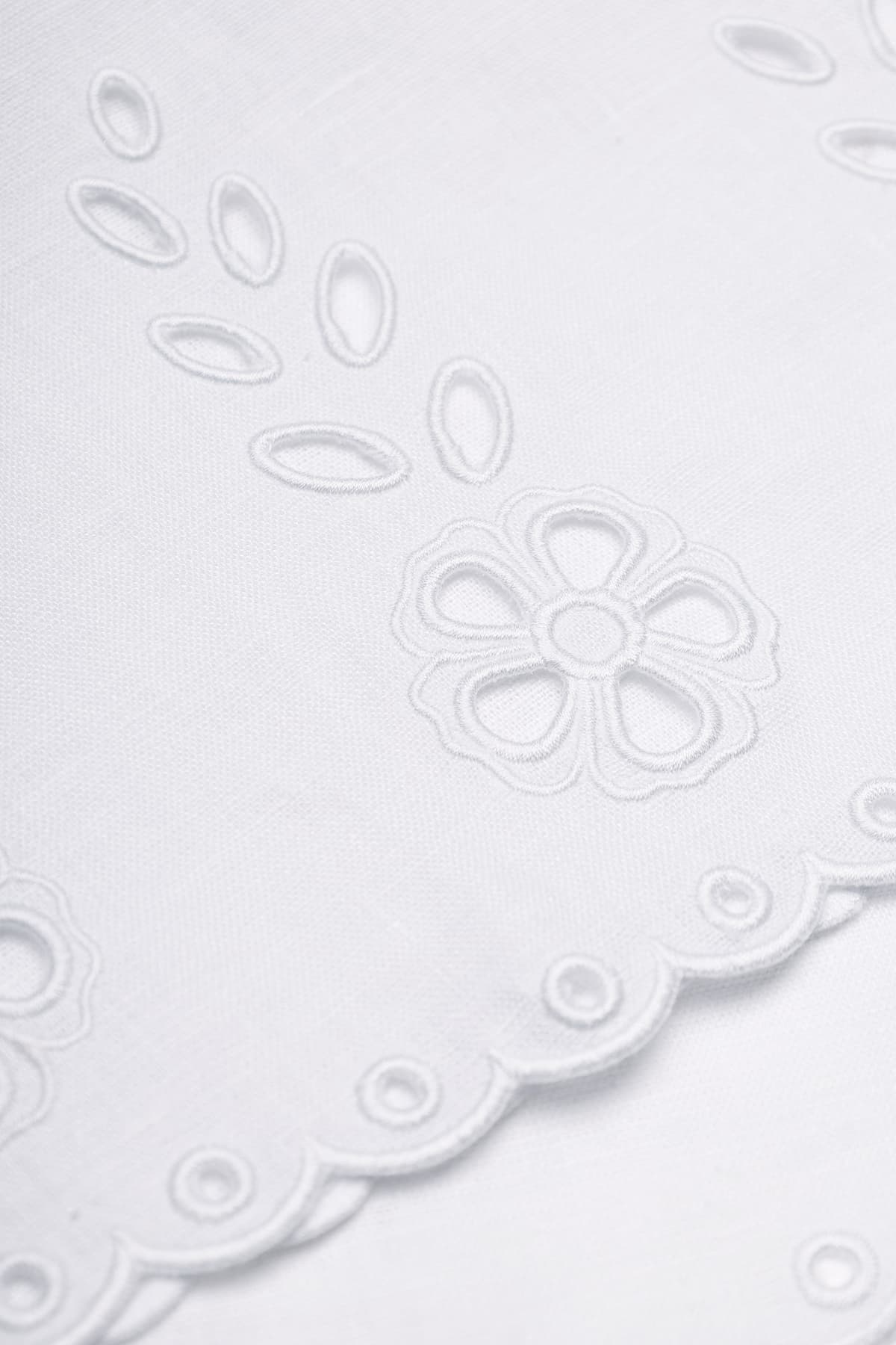 White linen cropped tank top with vytynanka cutout embroidery - fabric detail