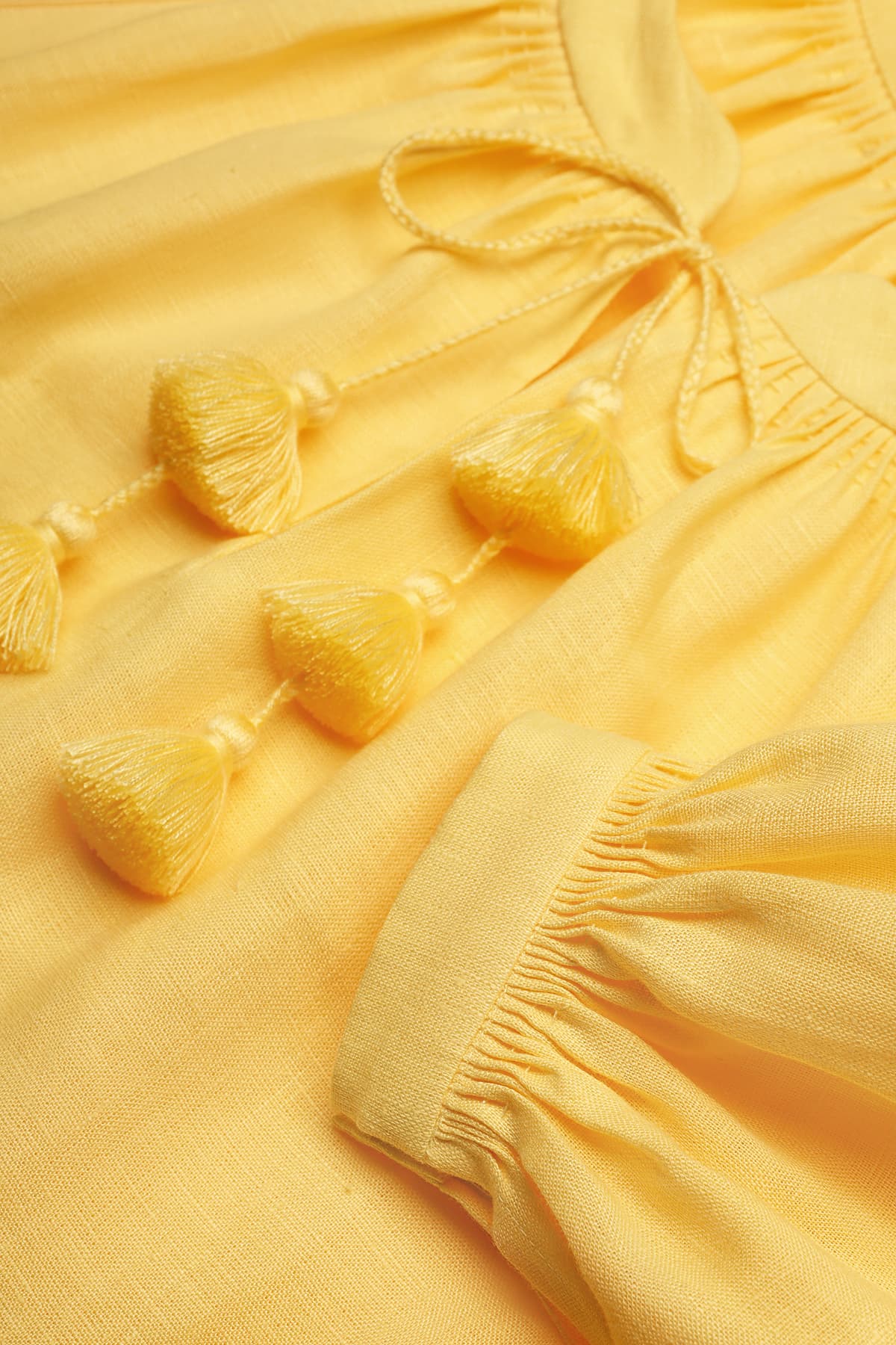 Yellow Foberini linen dress with tassel detail