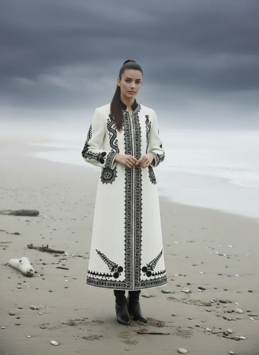 The Romanian Handcrafted Wool Coat in White by Wool Craftsmanship Embroidery styled on model, Blouse Roumaine Shop