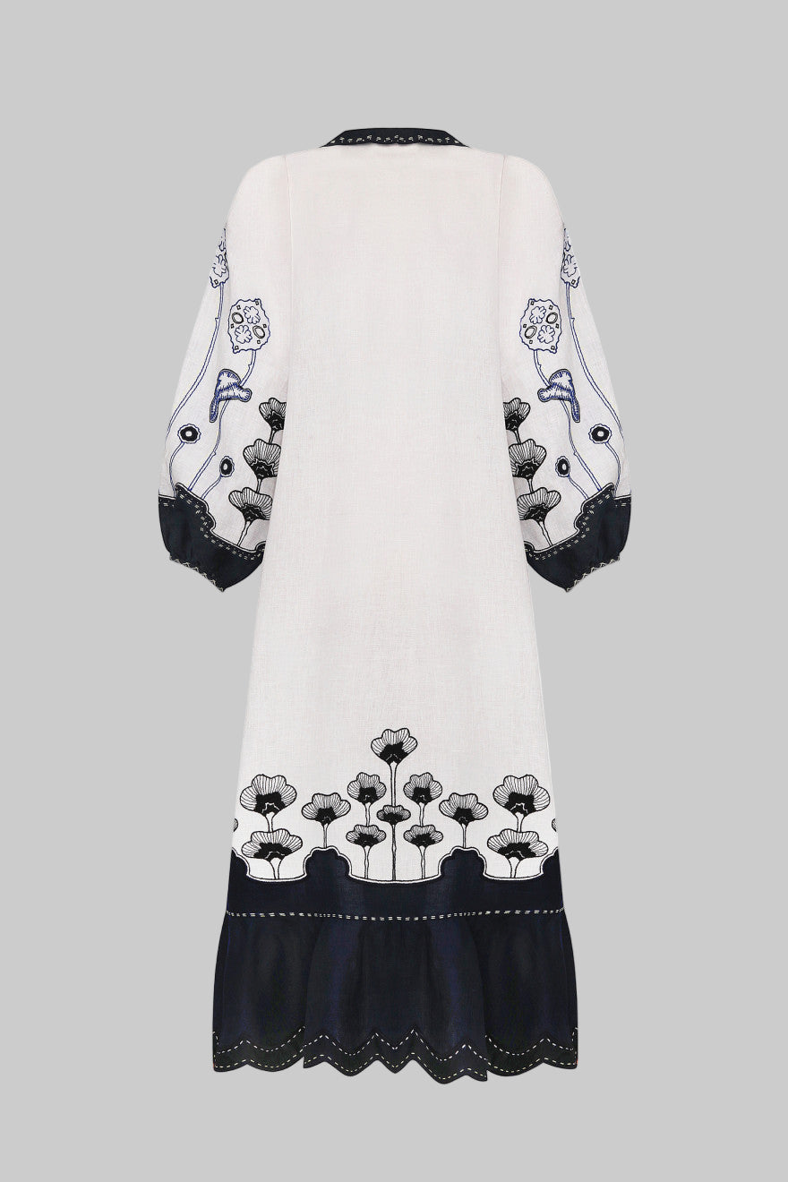 White dress with black floral embroidery on a white background